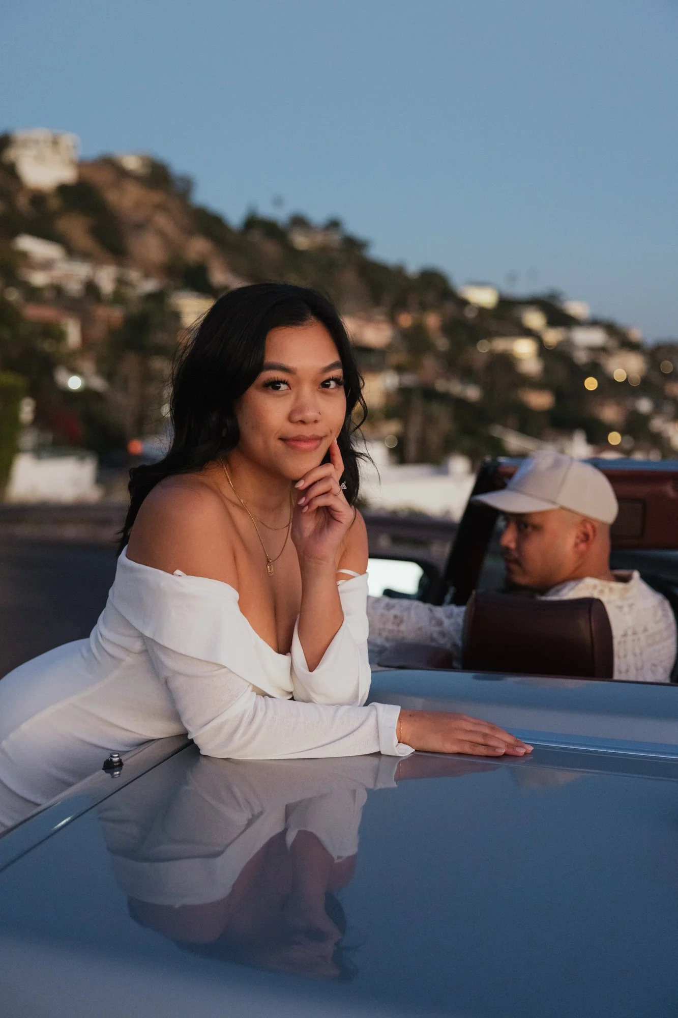 Golden hour engagement session in Malibu California with a vintage car overlooking the coast