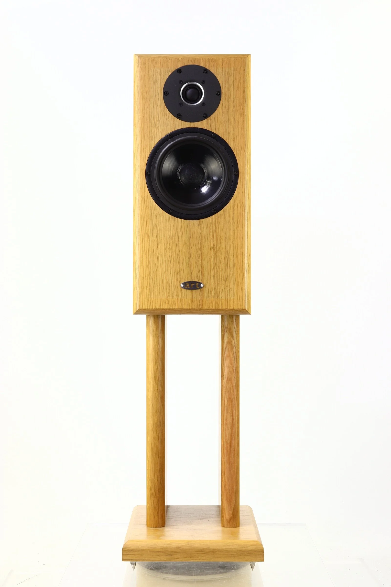 A tall wooden stereo speaker with two drivers, mounted on a matching wooden stand against a plain white background.