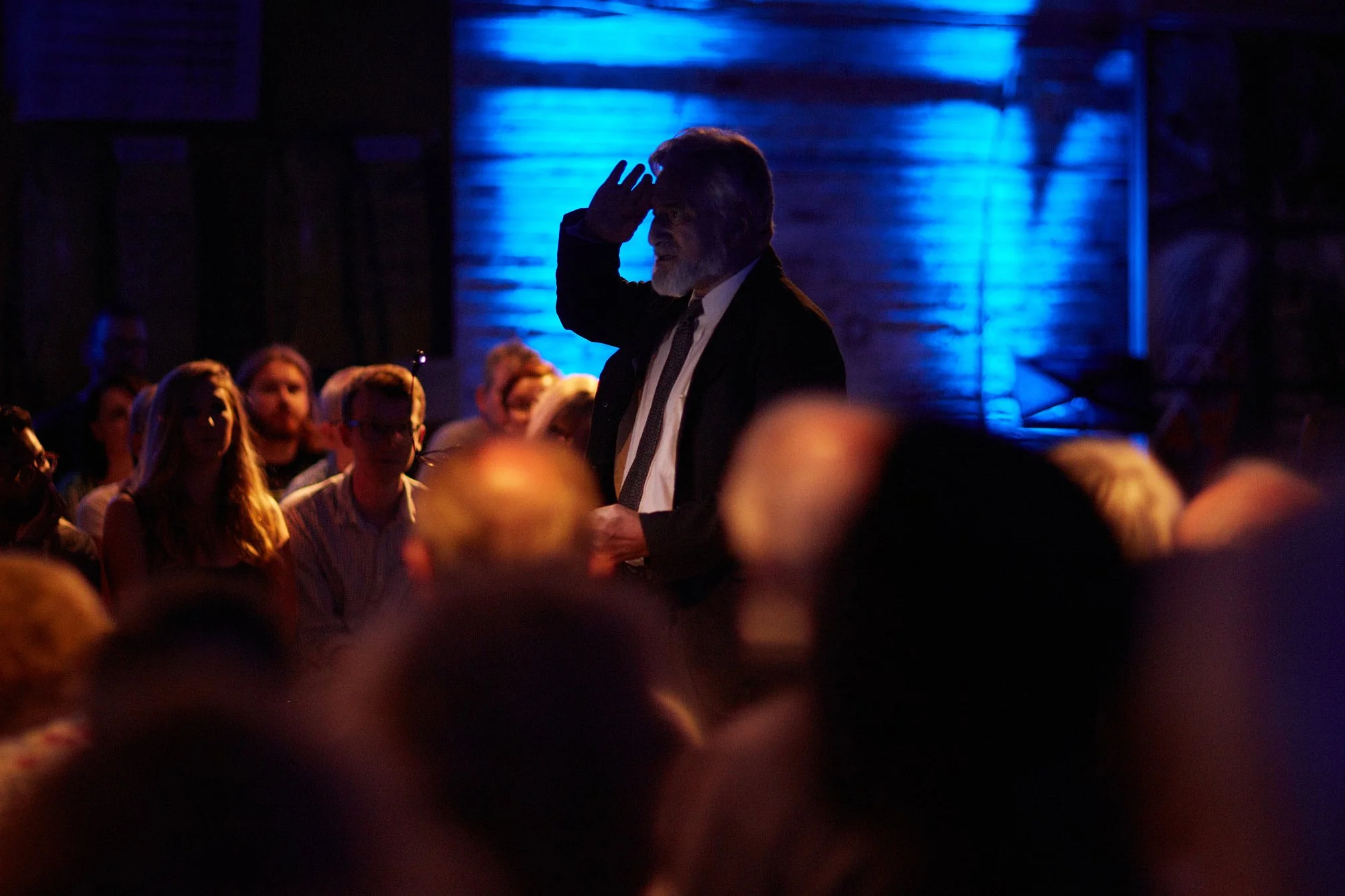 The Listening Post: Actor Henry Goodman standing amid a crowd at the Postal Museum, London.