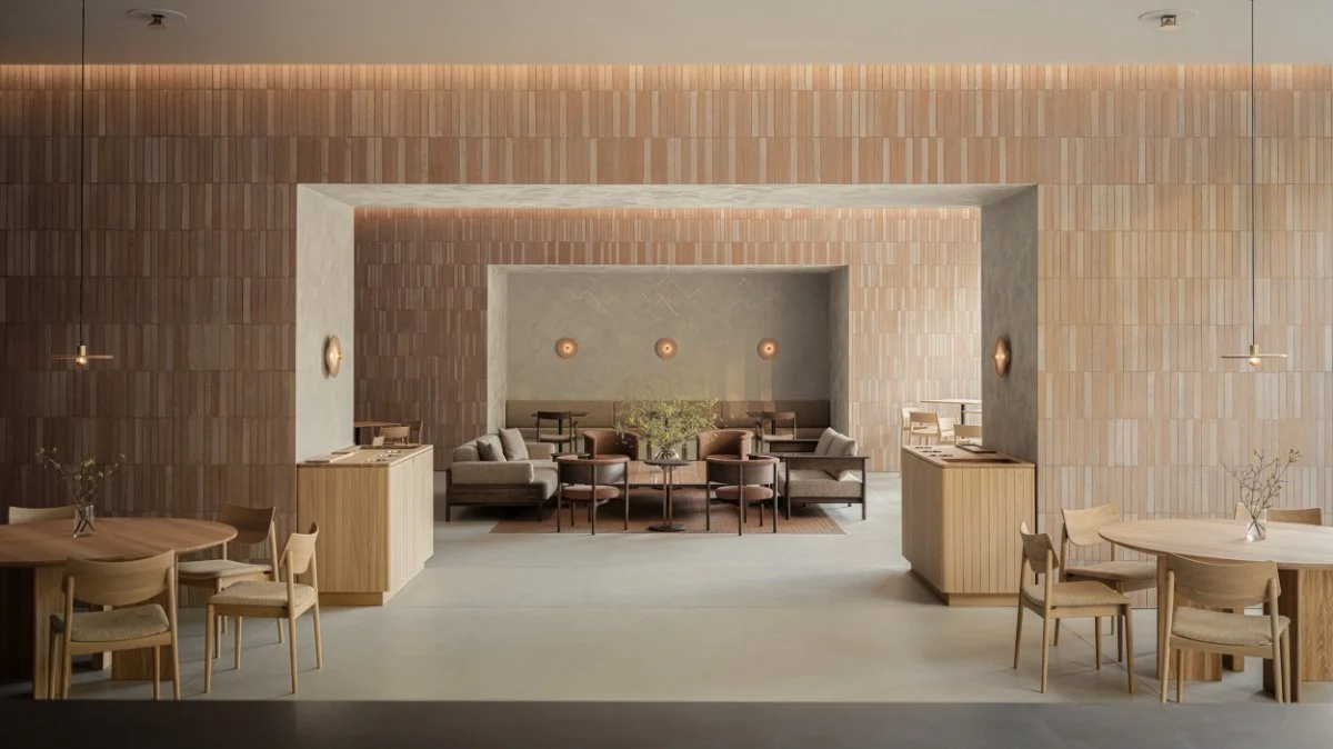 A modern, minimalist restaurant interior with light wood furniture, beige walls, and soft lighting.