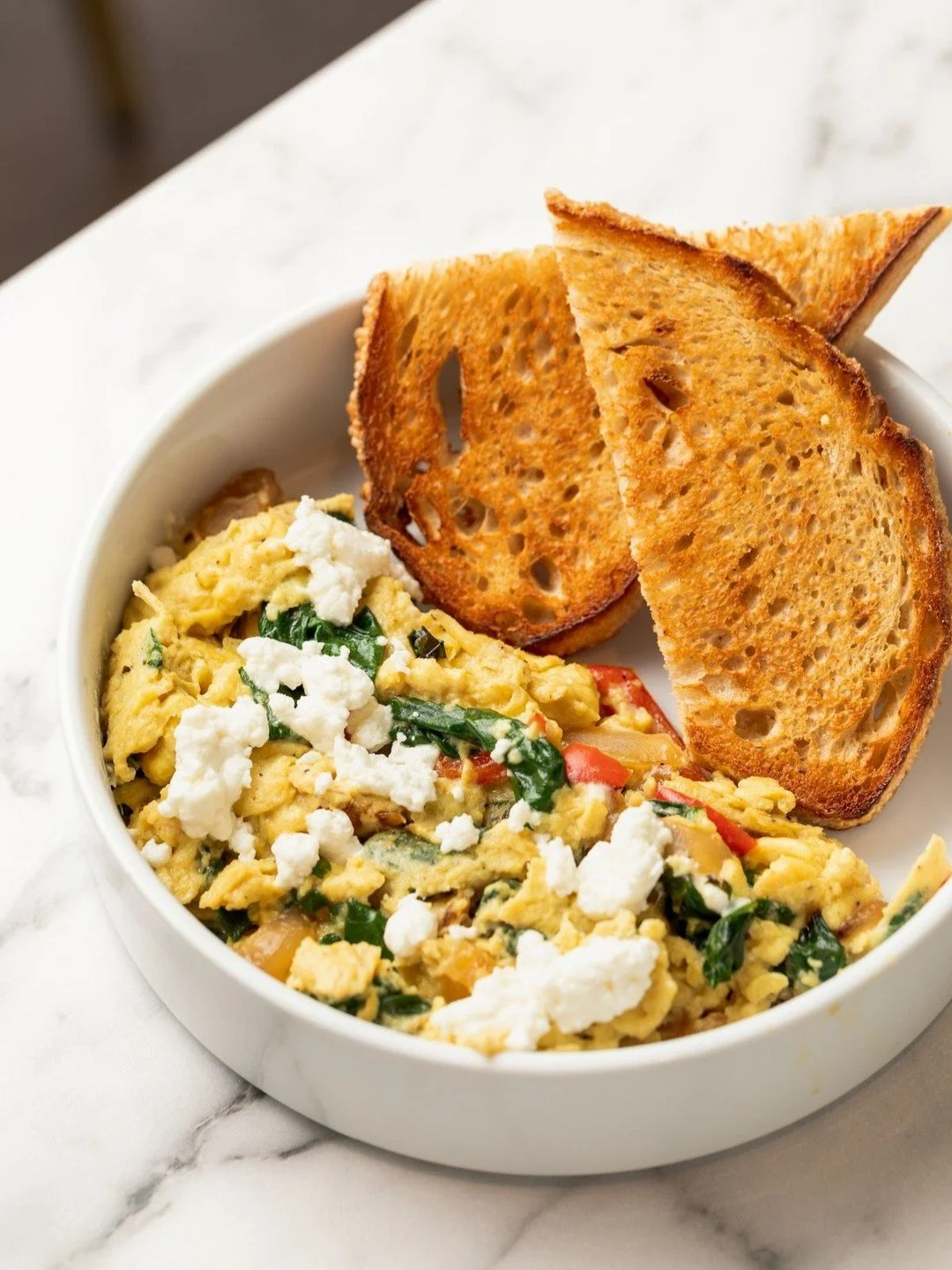 Happy National Egg Day to the real breakfast MVP.

Veggie Scramble | scrambled eggs, spinach, caramelized onions, peppers, goat cheese, toasted sourdough