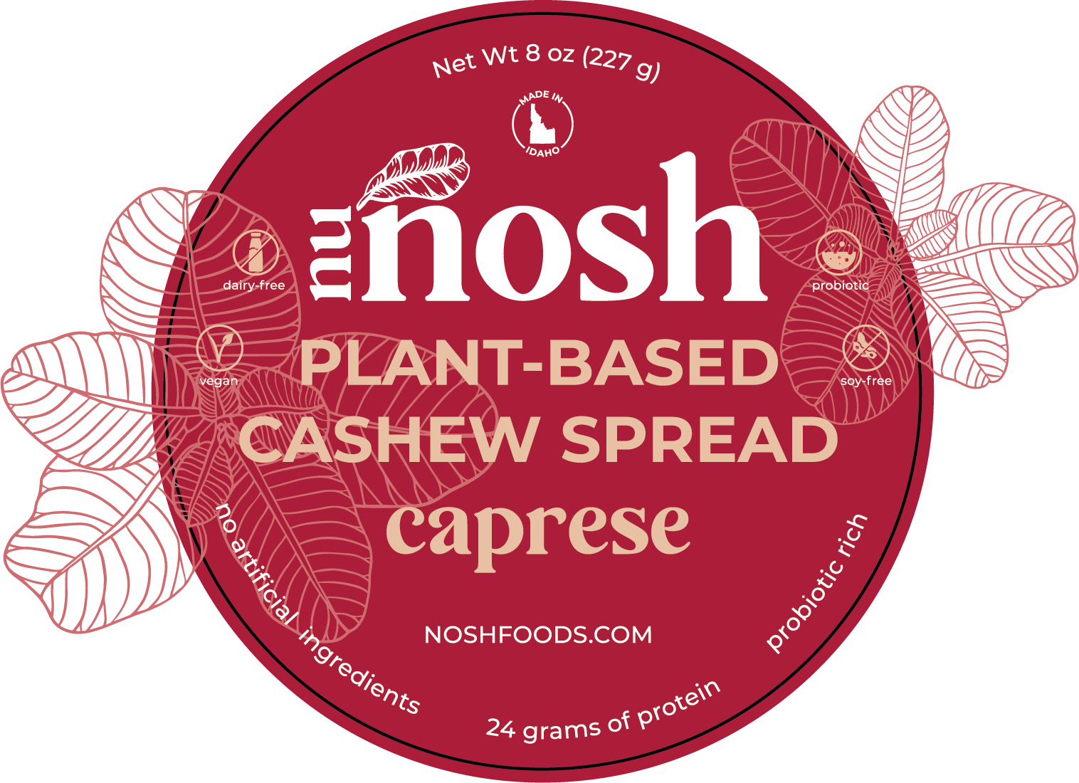 Label for Nu Nosh plant-based cashew spread, caprese flavor. Features text: dairy-free, vegan, probiotic, soy-free, no artificial ingredients, 24 grams of protein, probiotic rich. Net weight 8 oz (227 g). Made in Idaho. Red background with leaf designs. Website: noshfoods.com.