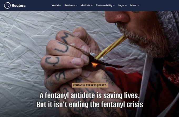 Person with tattoos using a makeshift device to freebase fentanyl on a dark background, illustrating opioid addiction risks. This photo was featured in a Reuters News Agency, Pulitzer Prize winning article.
