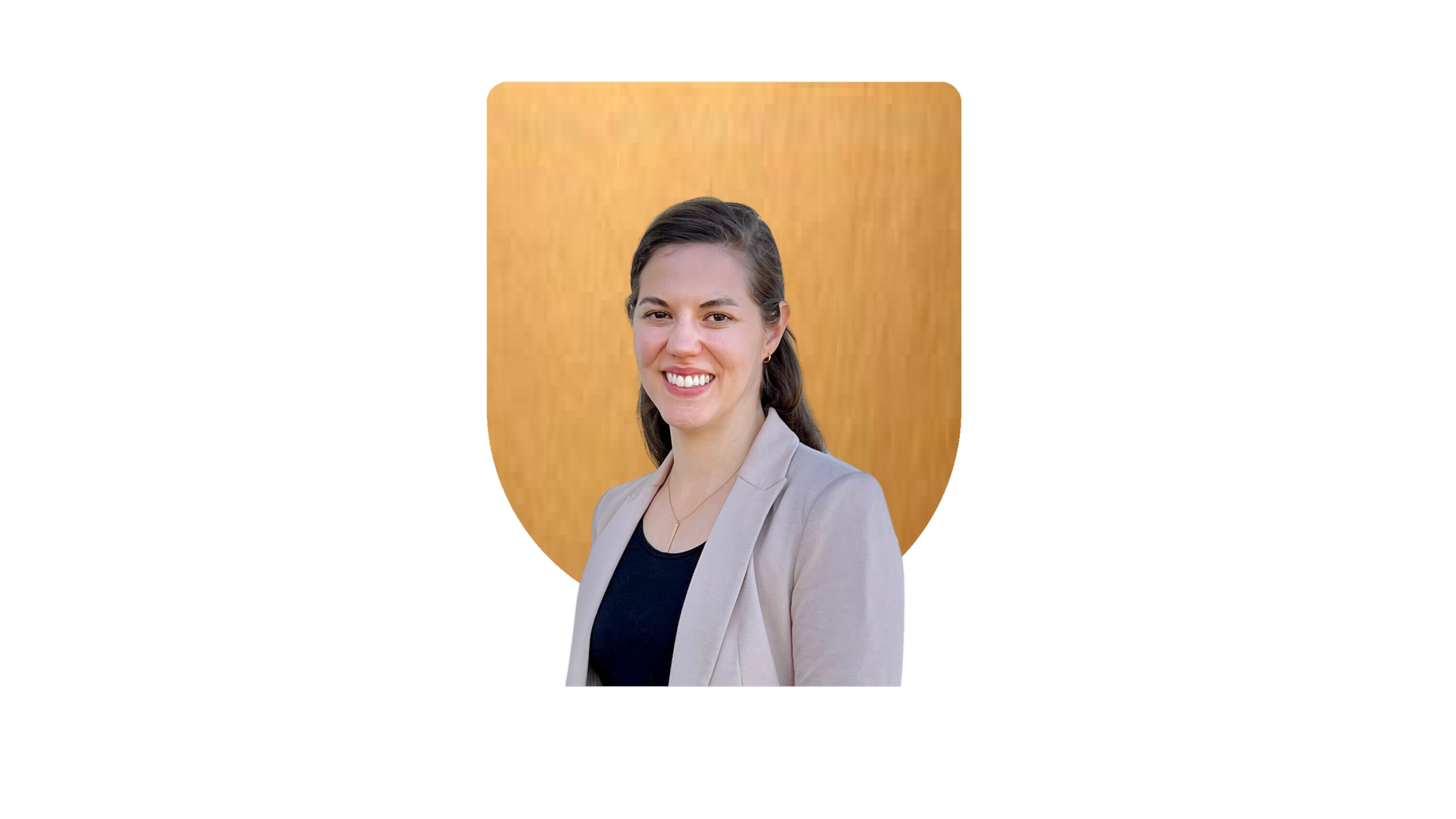 Smiling person in business attire with a beige blazer, standing in front of a brown shield-shaped background.