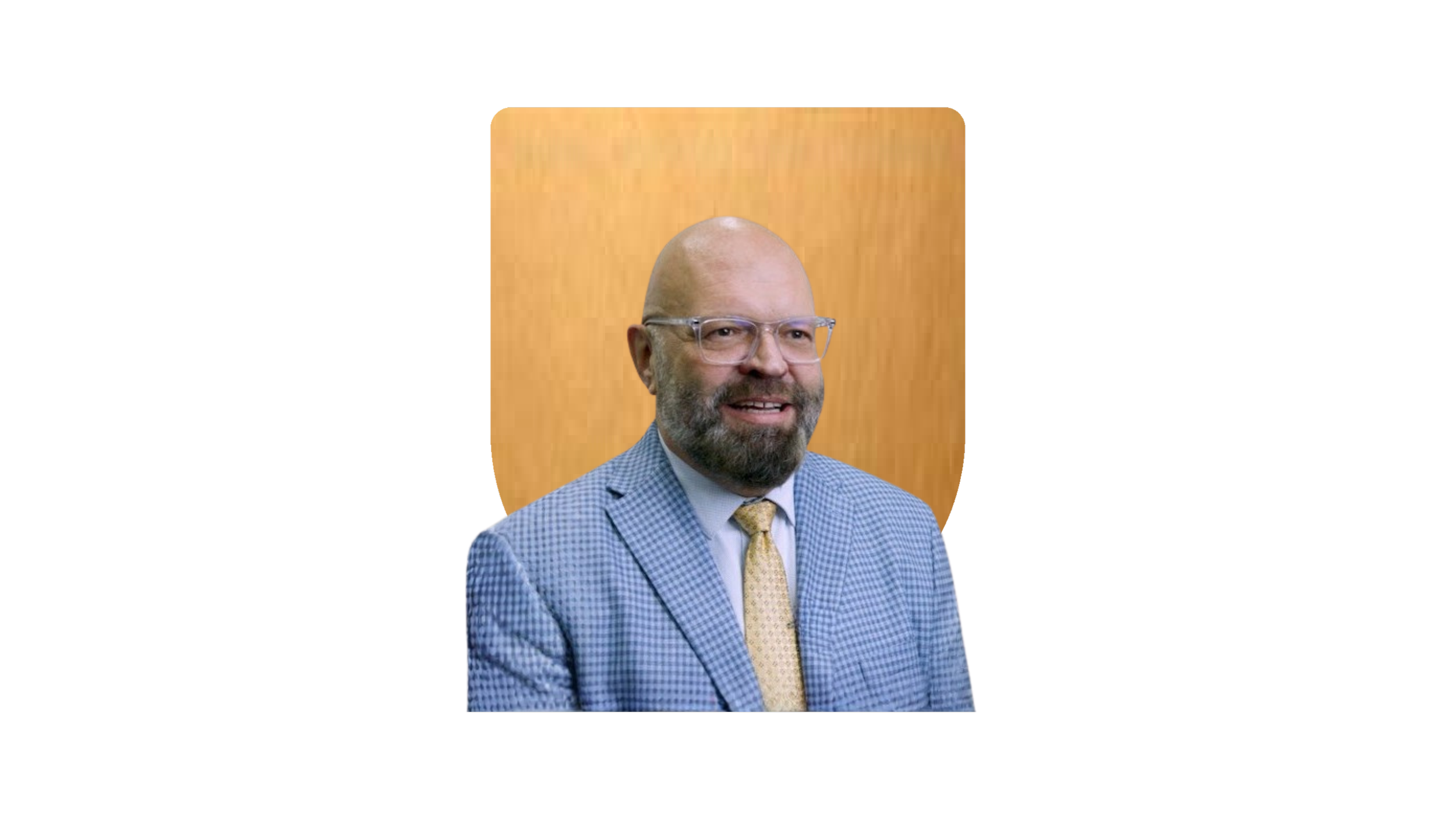 Man with a beard wearing a white lab coat against a gold shield background.