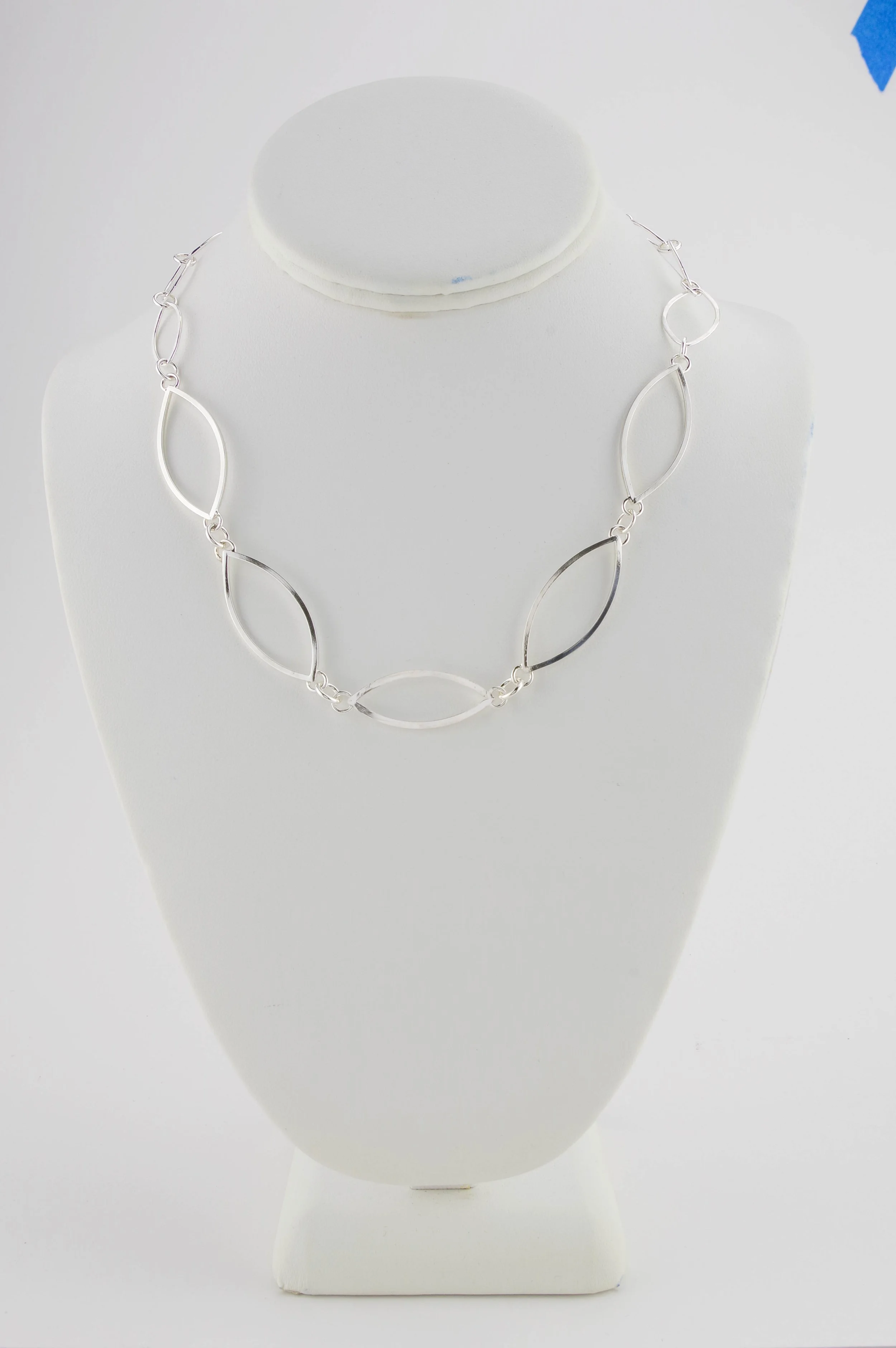 Sterling silver chain necklace with three sizes of leaf-shaped links.