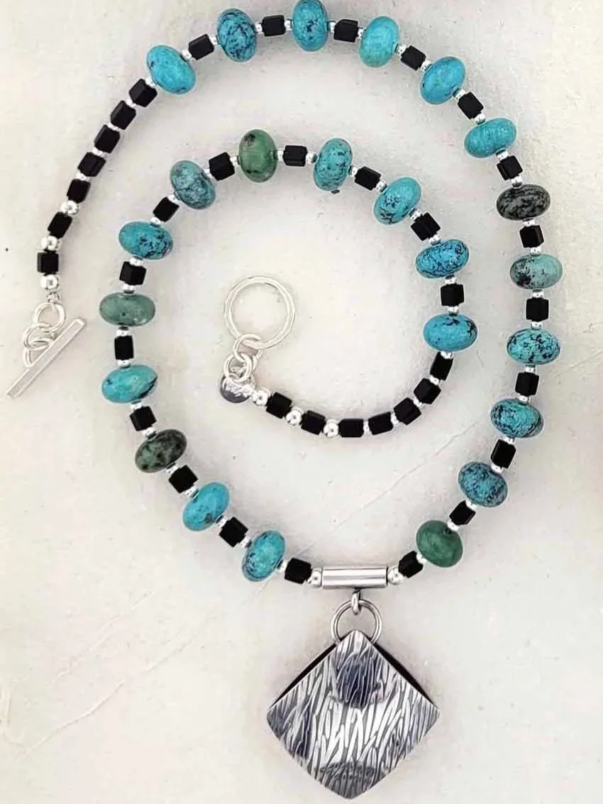 Turquoise+%26+silver+pillow+bead+pendant.jpg