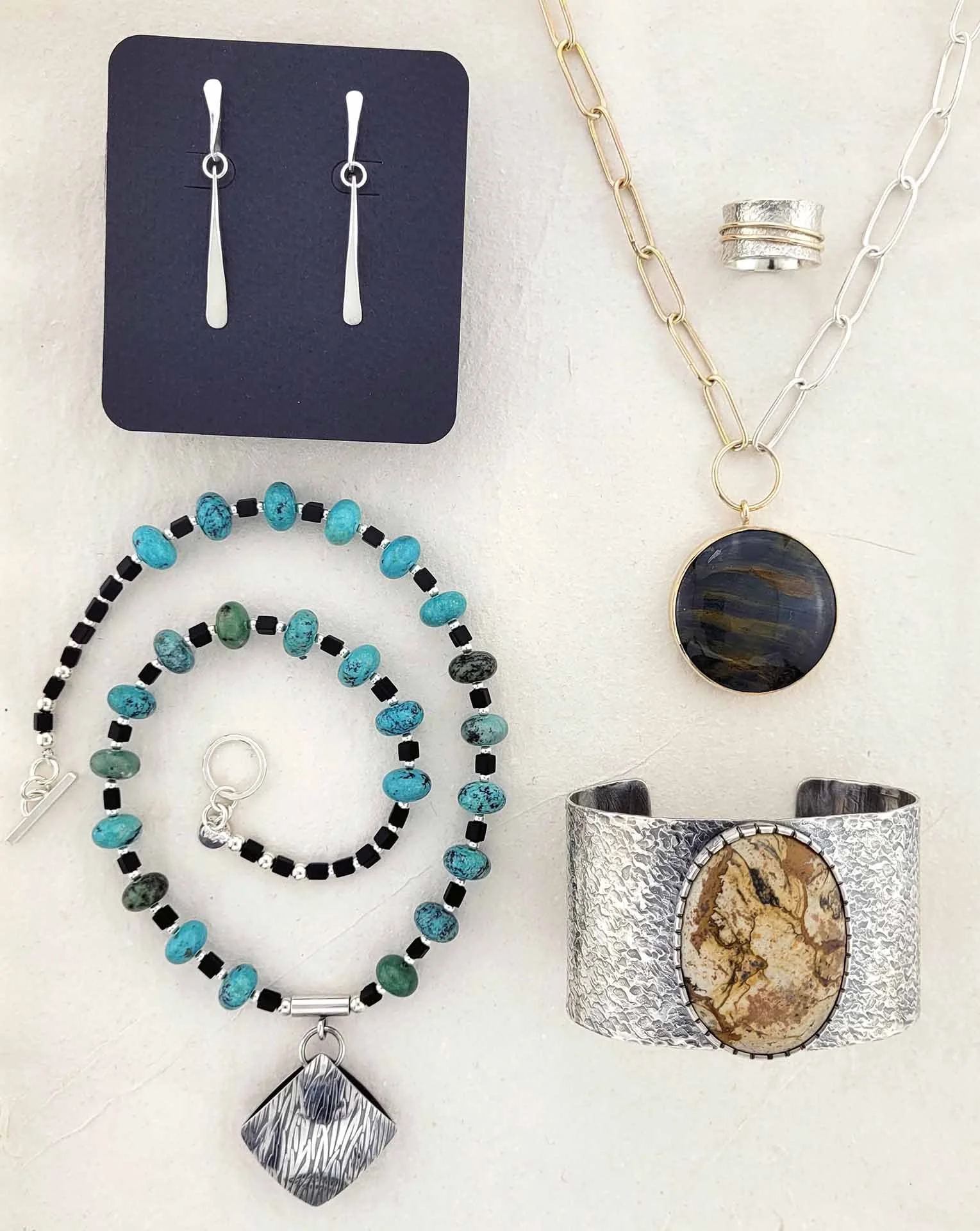 Flat lay Picture jasper cuff turquoise necklace Hawks Eye.jpg