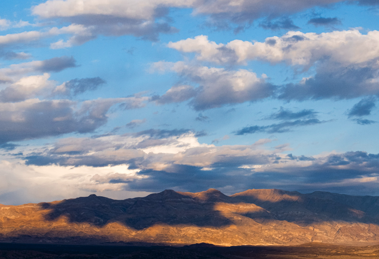 Rionnach maoim - Scottish Gaelic (pronounced: REE-oh-nach MWEEM)
The shifting patterns of light and shadow cast across mountains, or open countryside when clouds move overhead.