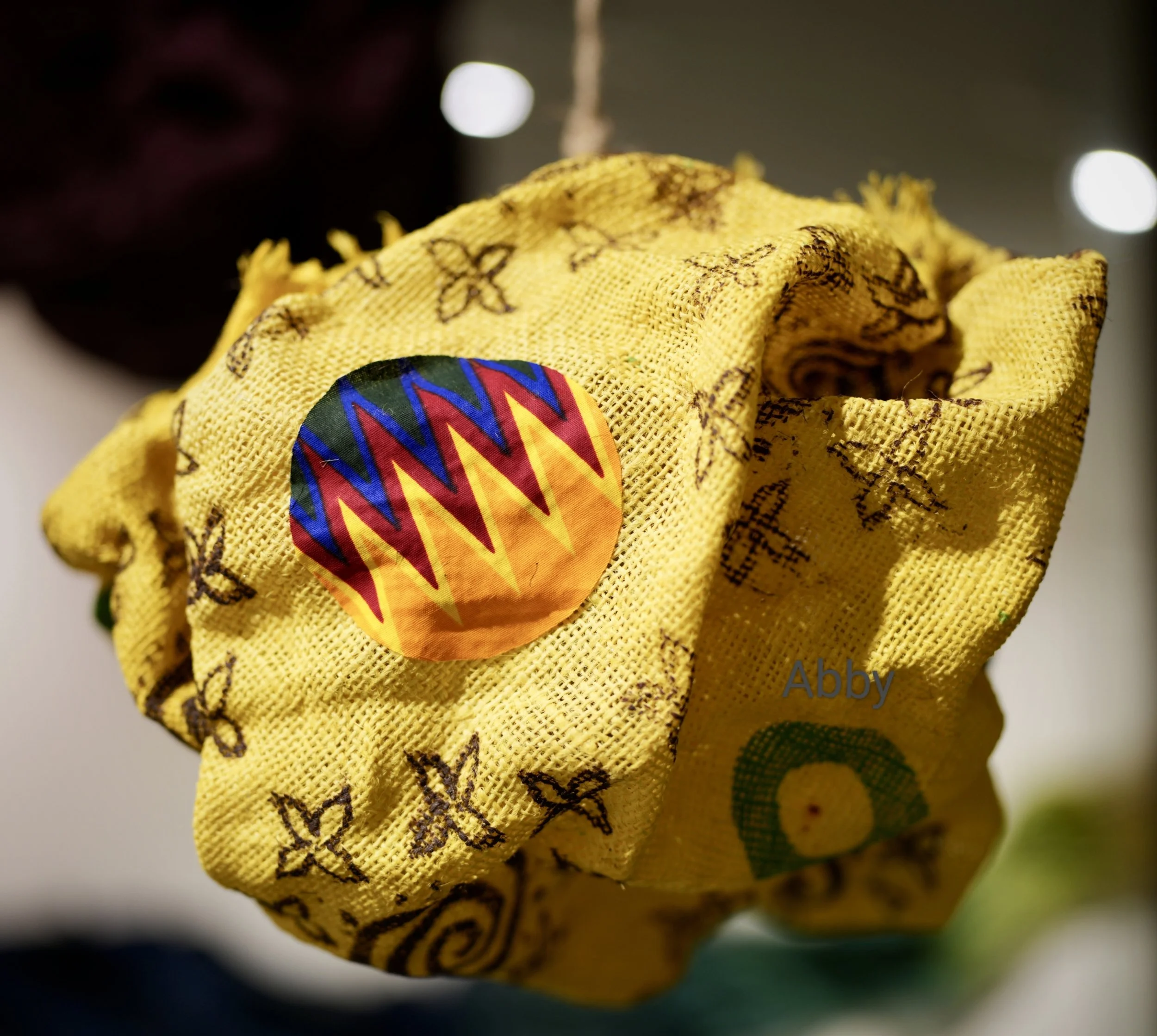 Close up of installation forms with screen printing and Ankara fabric collage.