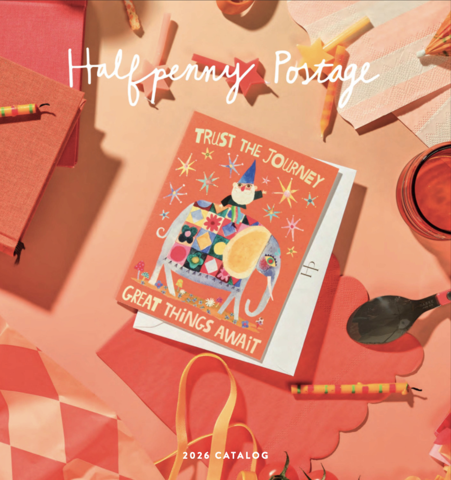 A person's hands hold a colorful postcard featuring stylized swans and the words "love" and "always." The background is pink with hearts, and the person is wearing a pink shirt and a silver wristwatch. Overlaid text says "Halfpenny Postage" and "2025 Catalog."