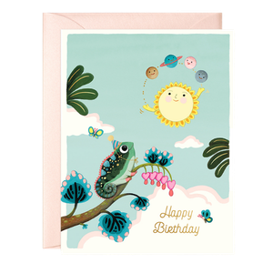 Colorful birthday greeting card with a gnome holding a fishing pole, standing on a large red and pink mushroom, surrounded by smaller mushrooms and a blue frog, with a night scene in the background, glowing fireflies, hanging flower branches, and a glowing lantern that says 'Happy Birthday to You.'