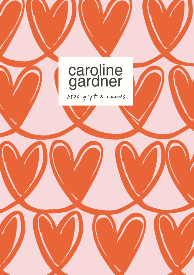Decorative cover with pink background and red hearts, featuring a white rectangle with black text that reads "caroline gardner $26 gift & cards".