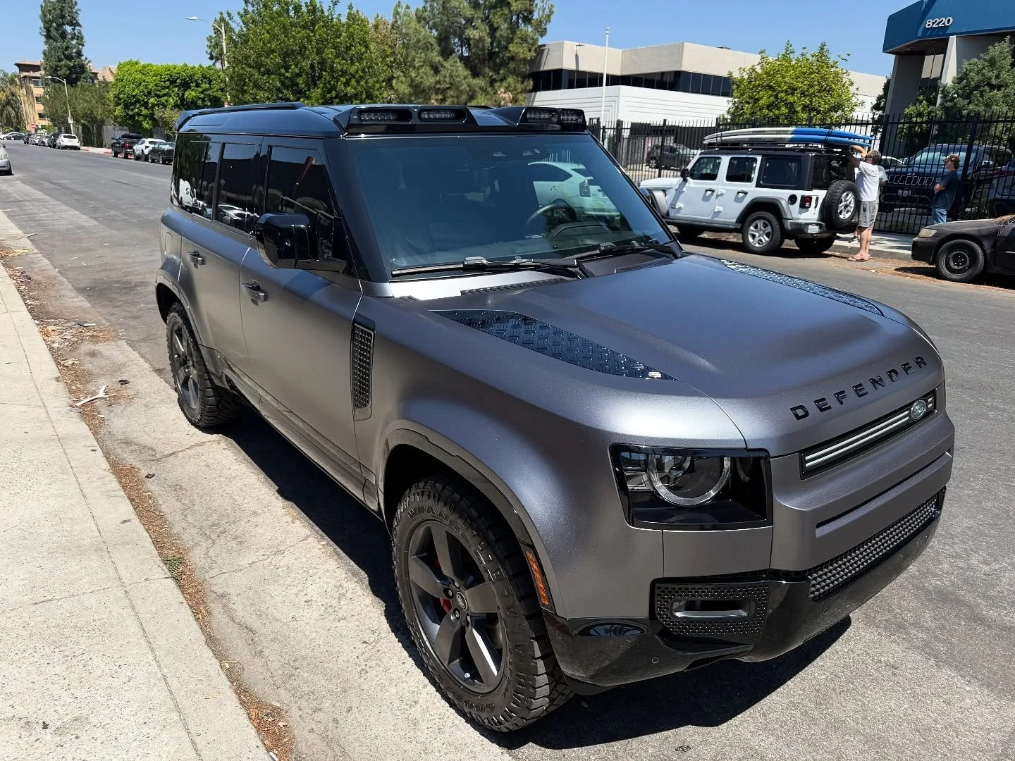 Satin Dark Grey on this Defender, along with gloss red painted calipers and red powder coated tow hooks topped off fully ceramic coated! #ezw #eziewraps #defender #landfoverdefender #satindarkgray #powdercoatingservice #ceramiccoatings #carwrap #viny