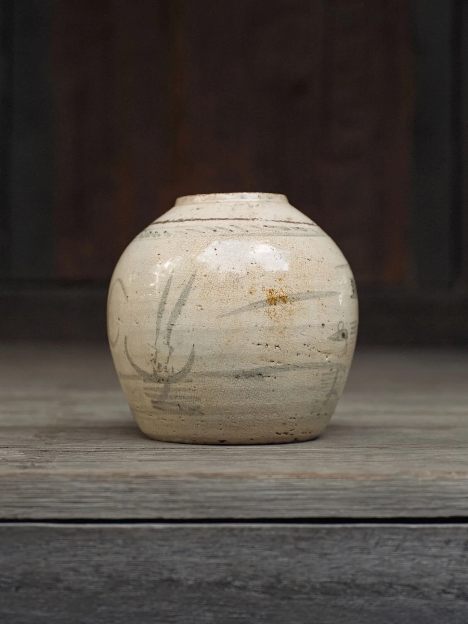 East Asia rounded stoneware vase, creamy crackle glaze showing brush-painted motifs