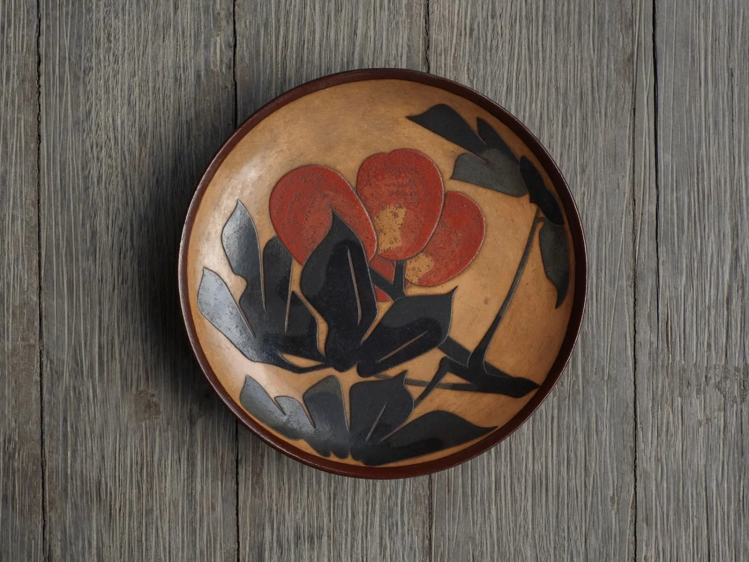 japanese offering plate in urushi lacquer with golden biwa fruit motif showing top of the plate