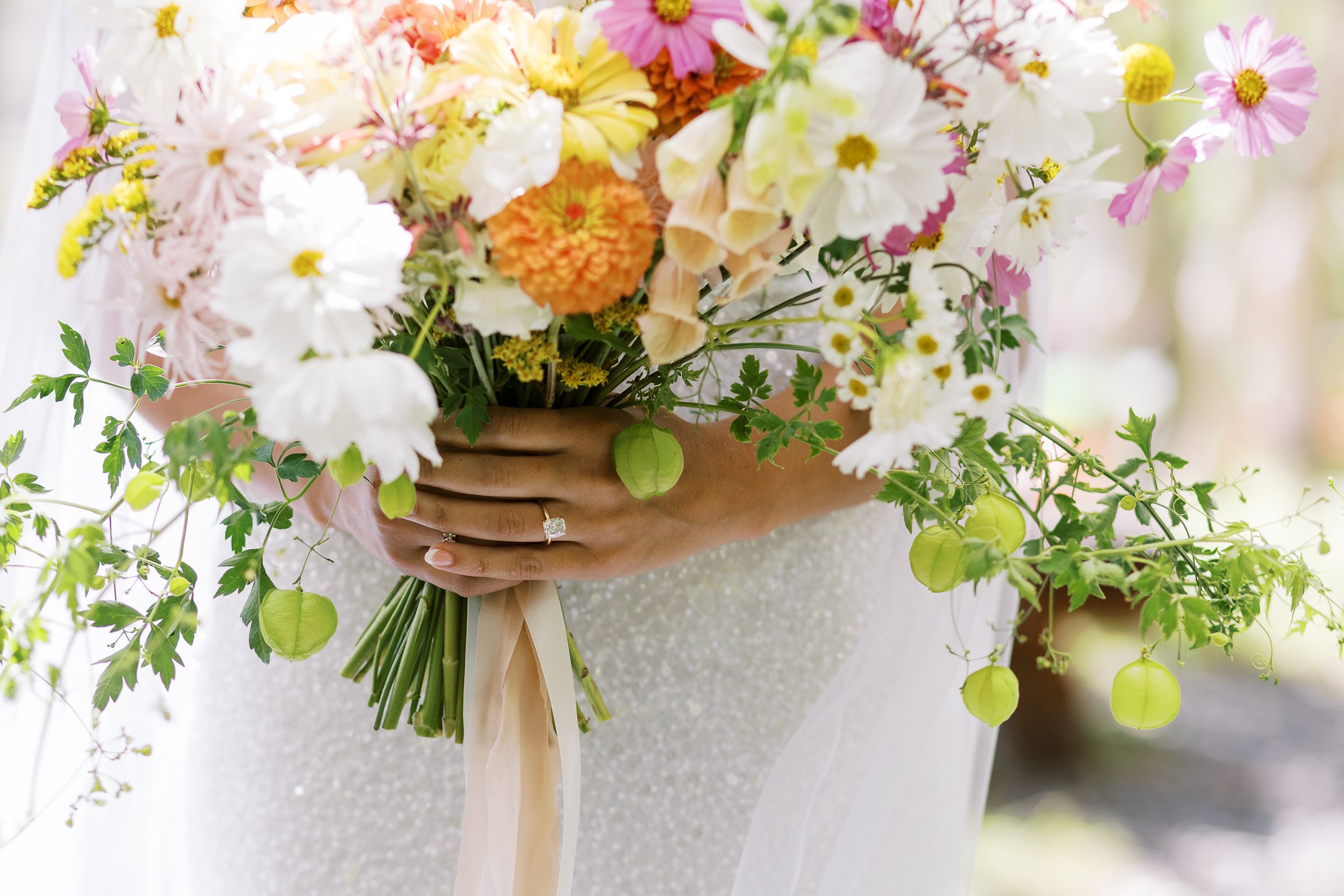wildflower themed bridal bouquet from the first week in september at June Mountain, featuring cosmos and zinnias