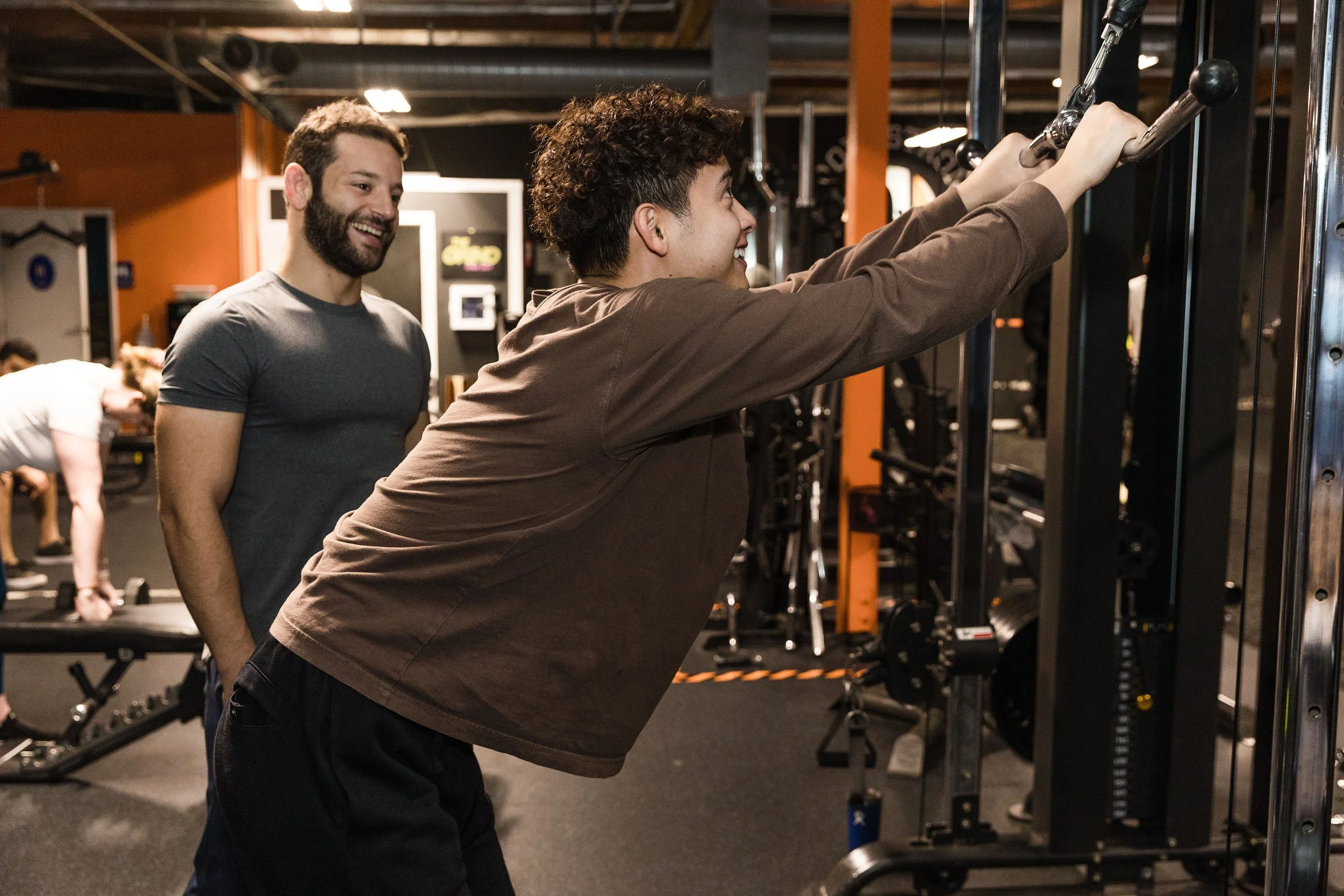 OmniFit personal trainer coaching a male client in San Diego — strength and weight-loss program for men over 30