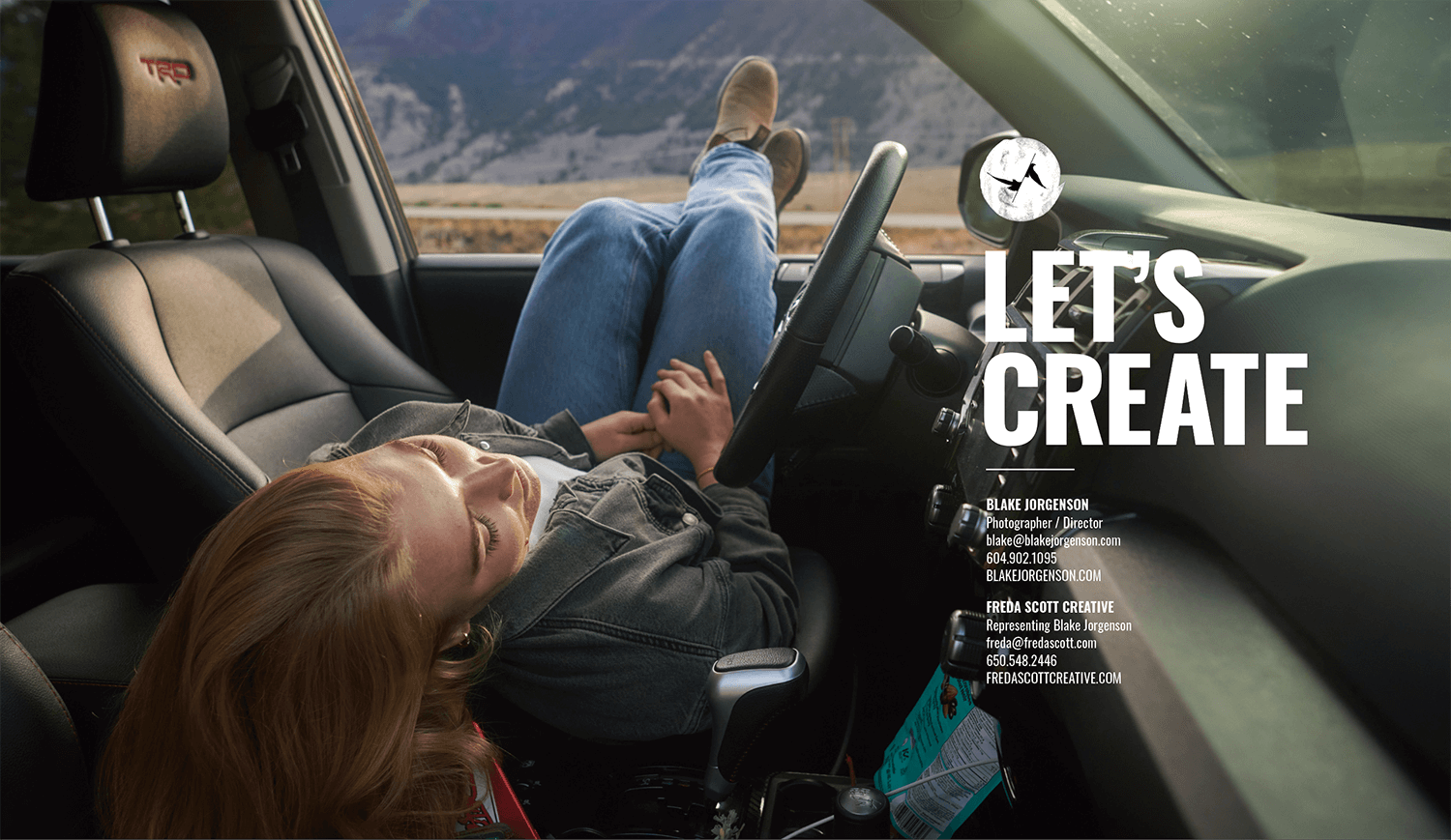 Woman laying across front seat of car with her feet out the window.