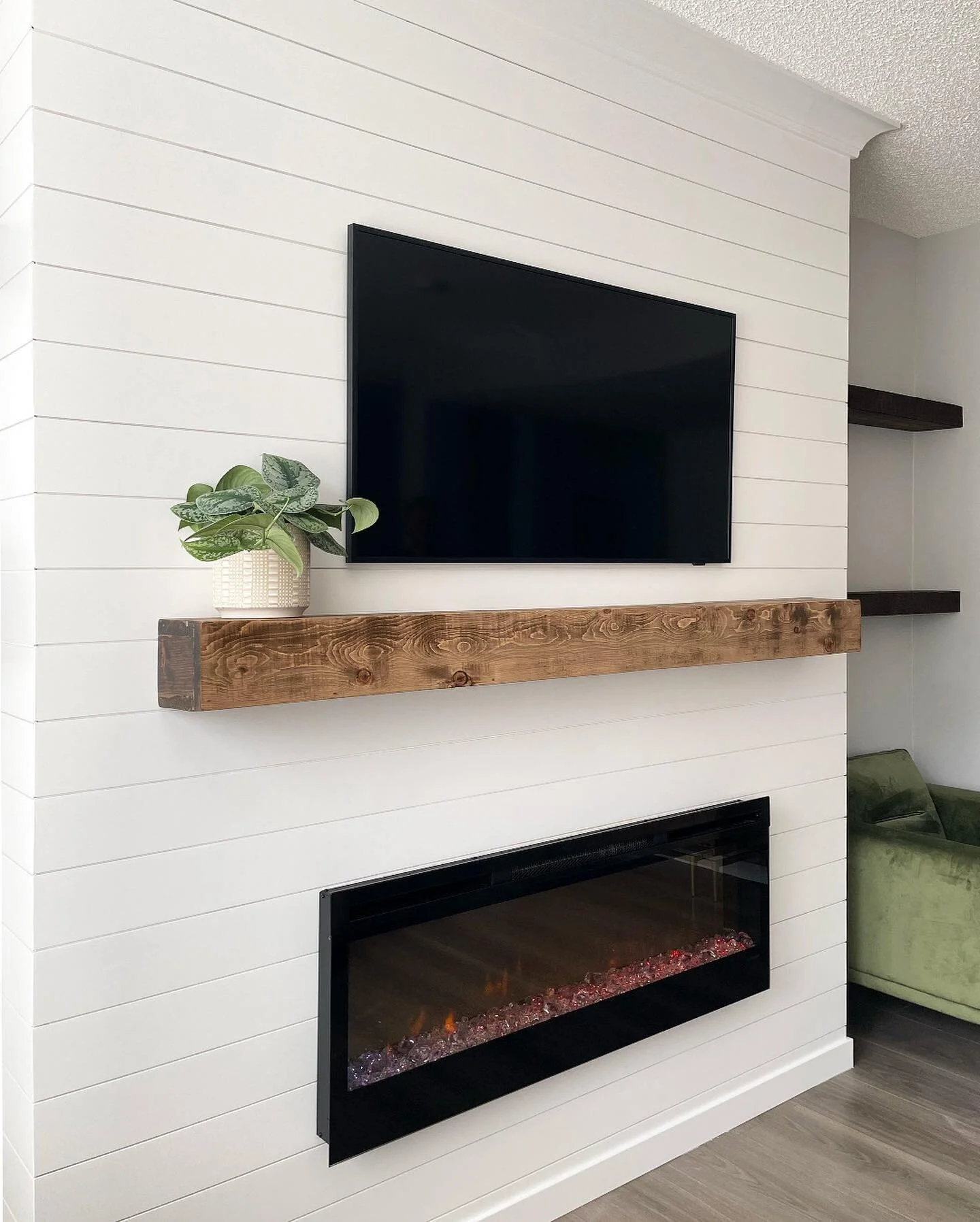 This was once just a plain wall &mdash; but now, it&rsquo;s the feature of this entire space! Custom-built fireplace with painted clear pine shiplap and rough-cut fir floating shelves.

#shiplap #clearpine #benjaminmooreokotoks #miterededges #firshel