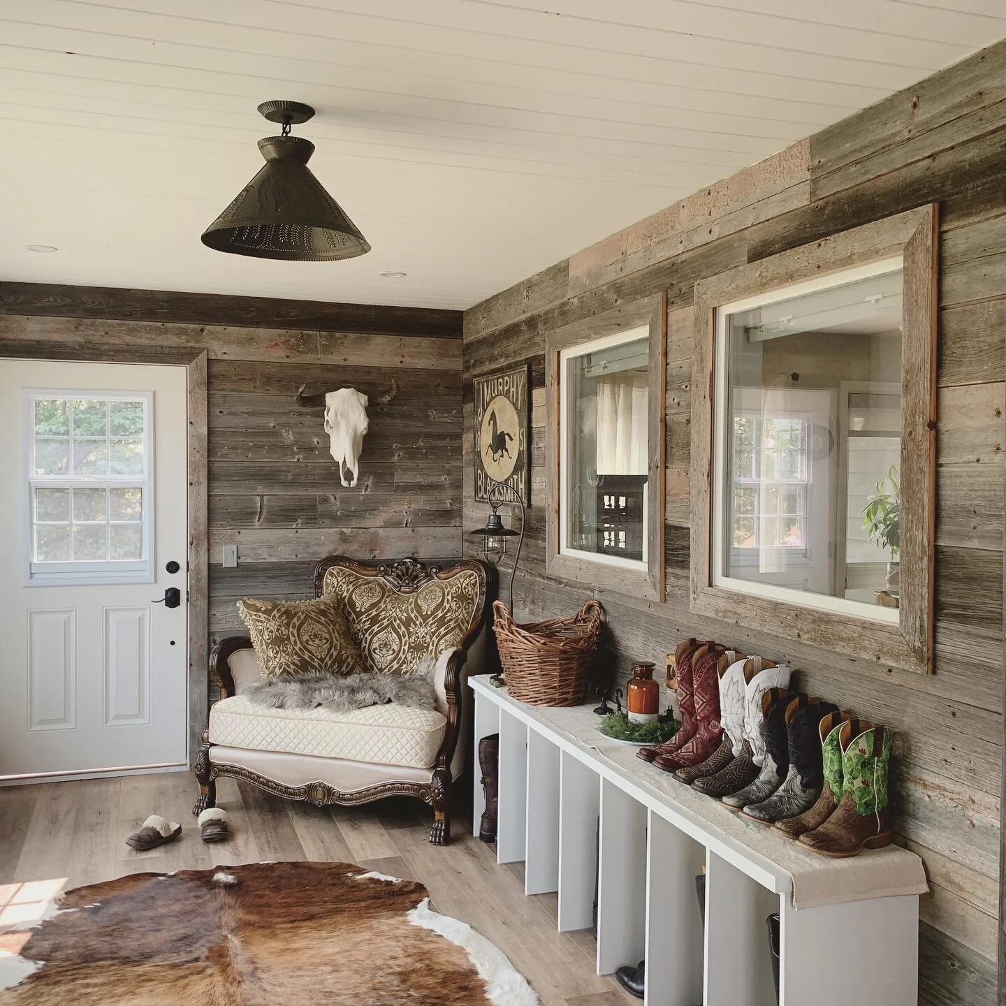 This country-style custom mud room is ready for fall. Complete with 100+ year-old barn board from Saskatchewan, custom built pine shelving and cubbies, barn lighting, and some lovely decorative touches. This home addition was a fun one, exterior pics