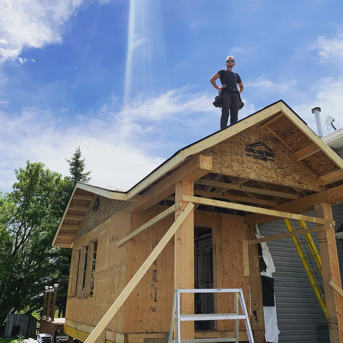 This southern Alberta farmhouse is getting a big mudroom addition! Soon to be complete with entrance timbers, barn board interior walls and custom benches/cabinetry. #farmhousestyle #mudroom #houseextension #dontfall