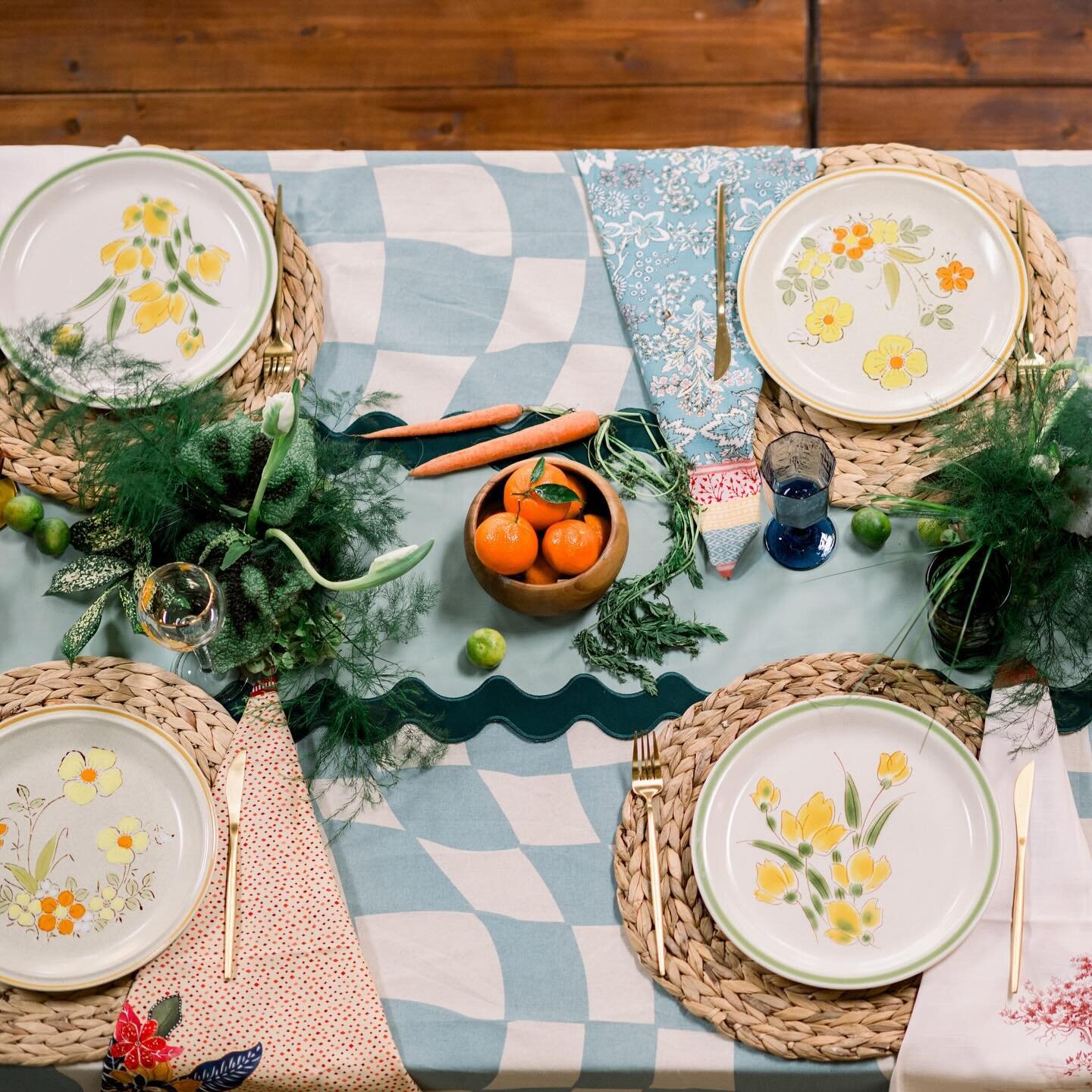 Entering our horticultural era 🥬🍊 We are all into the unexpected, like our vintage stoneware plates + 70s glassware on modern checkered linens, wavy runners, and mixed botanical patterns. Add a vegetable and fruit garden with the talented @lilyfore