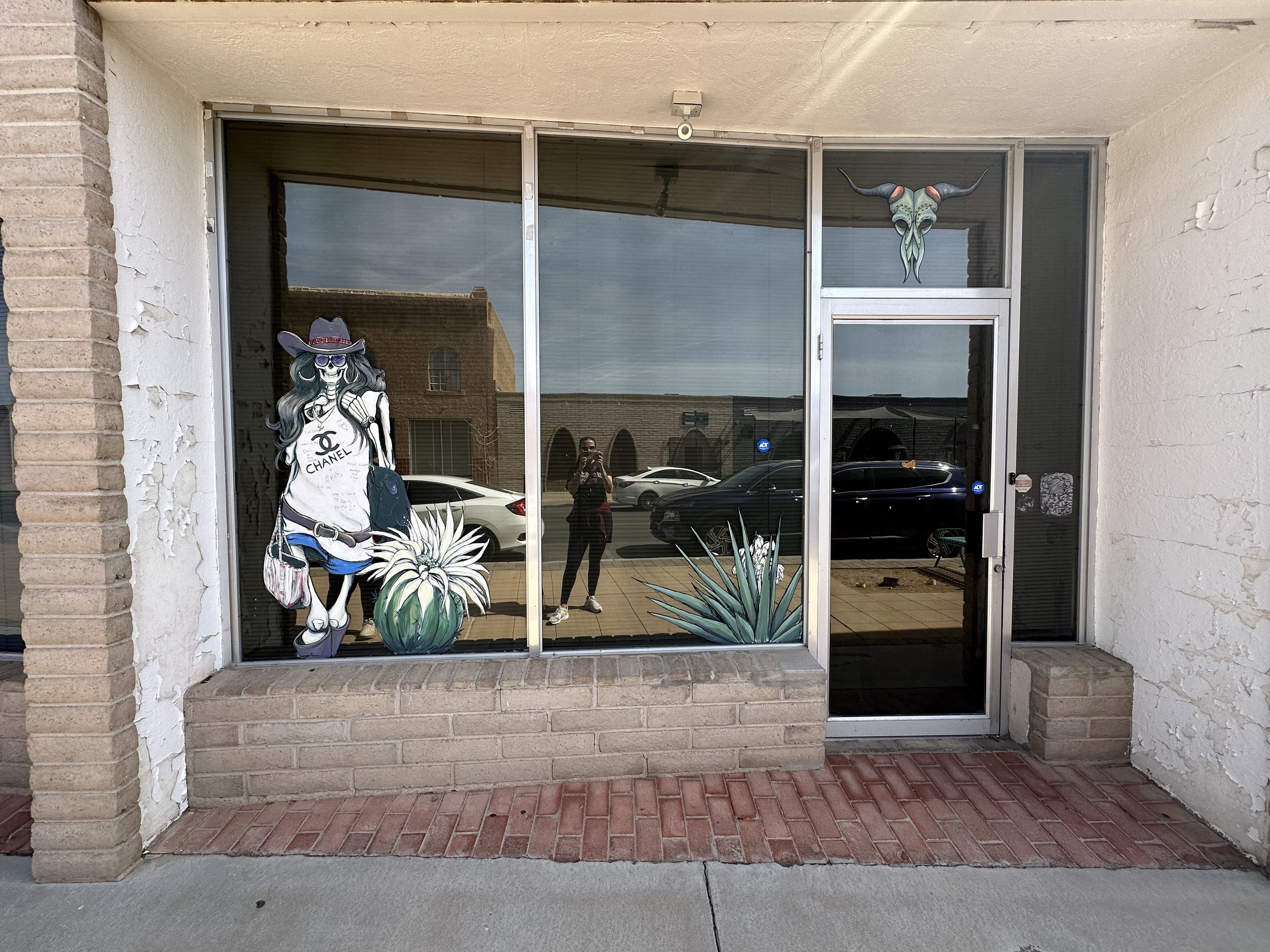 MainSt.WindowPaintingSkeletonWoman.jpeg