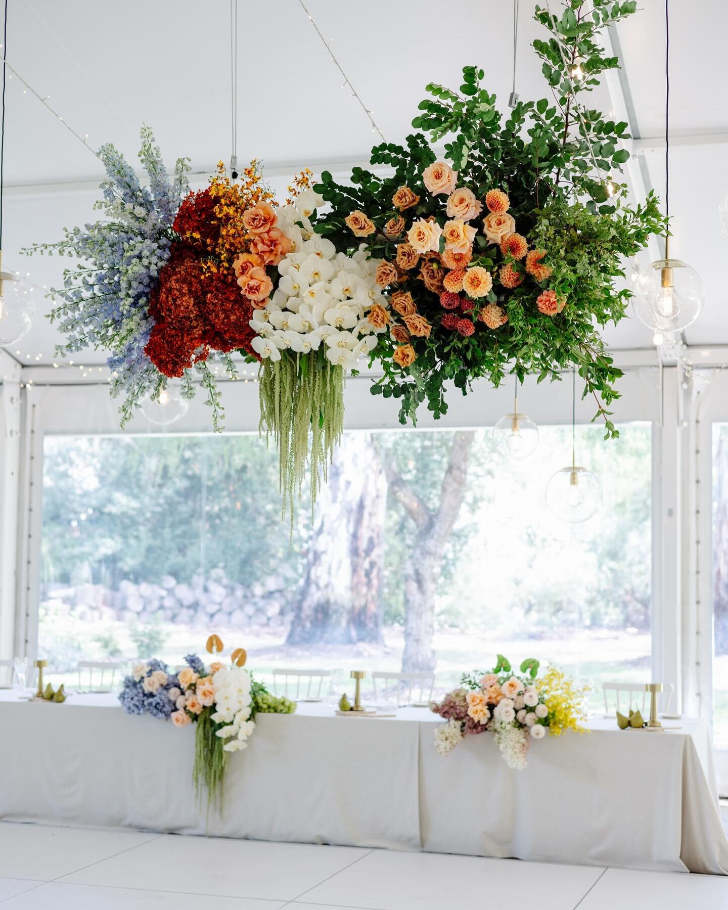 A custom concept hanging installation for Sophia &amp; Tax 🧡 

We can&rsquo;t wait to show you more from this wedding!! Pops of orange, blues, purples mixed with the classic whites and greens. 🤩

Venue: @sunnybrae_estate 
Lighting: @venue.productio