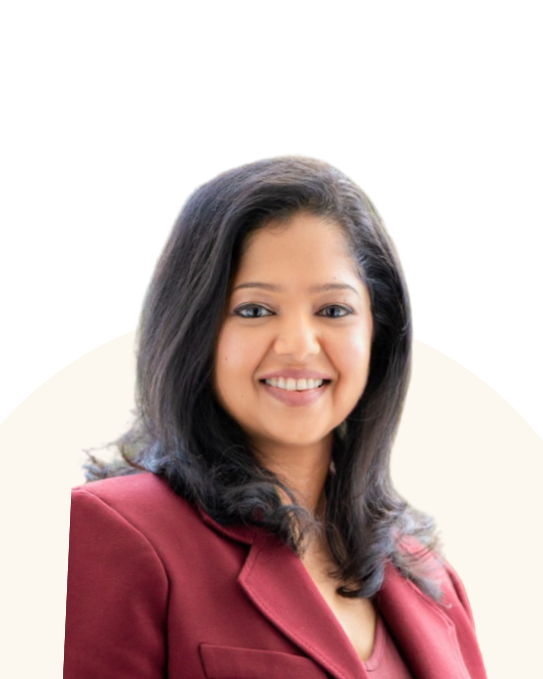 A woman with shoulder-length dark hair, smiling, wearing a burgundy blazer.