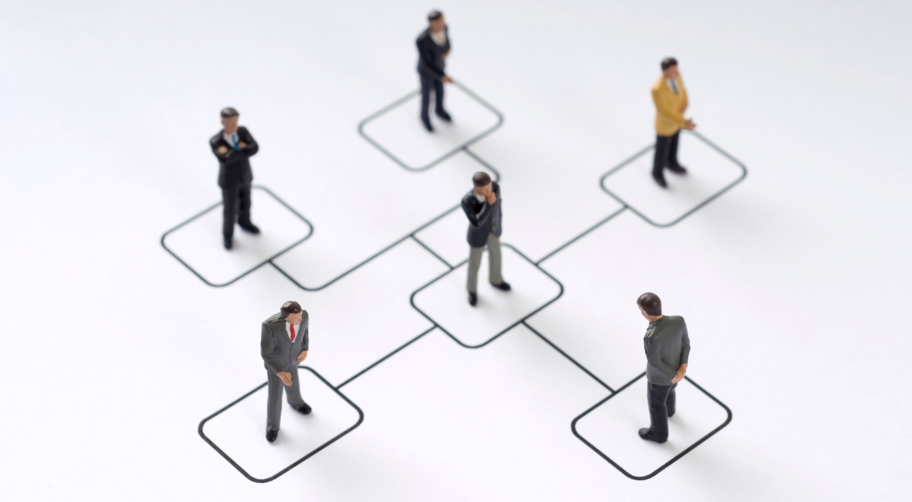 Stylised figures standing on connected role positions, illustrating how people occupy formal structures during organisational restructures.