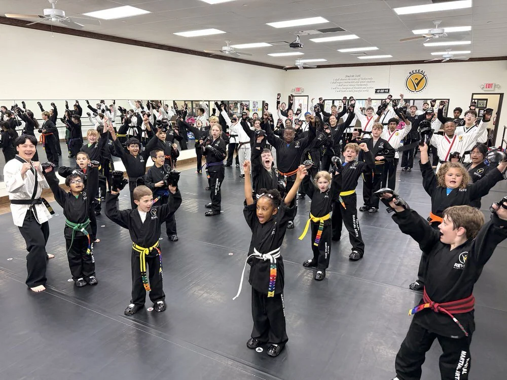 Kids and teens participating in a traditional martial arts class at Reveal Martial Arts in Southlake, building confidence, discipline, respect, and resilience.