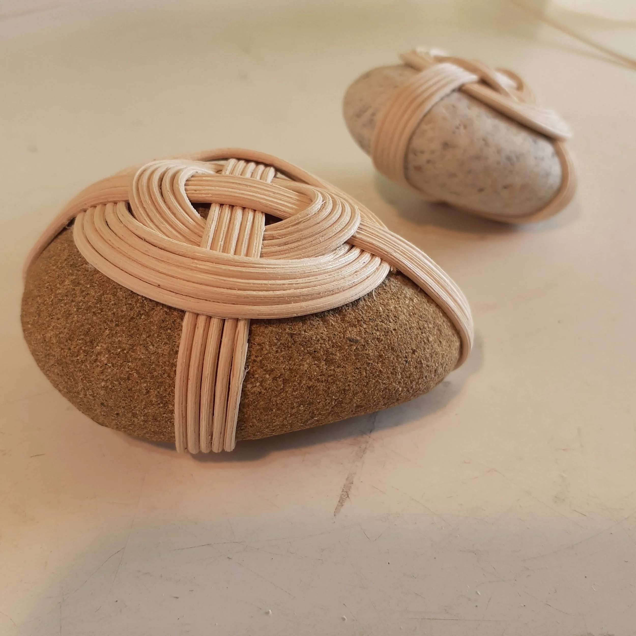Wrapped stone by New Zealand basket Maker Tanya Doty