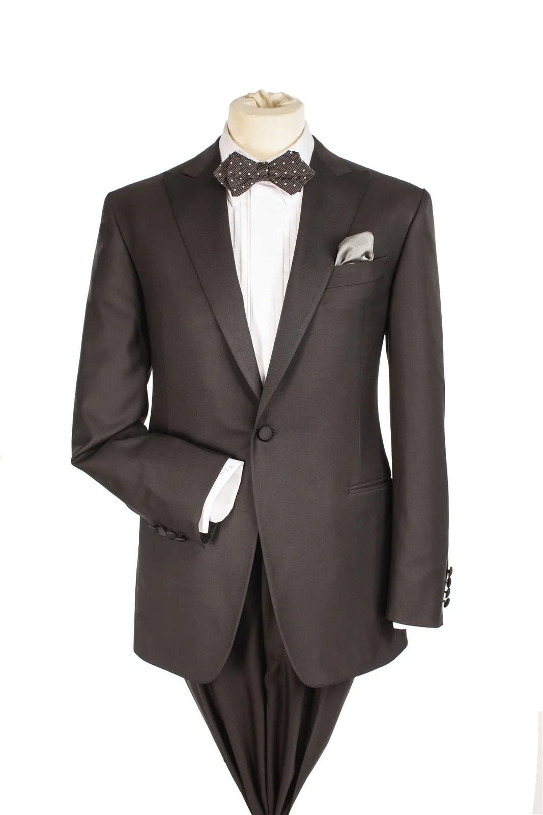 Charcoal one-button tuxedo jacket with satin peak lapels, polka-dot bow tie and silver pocket square