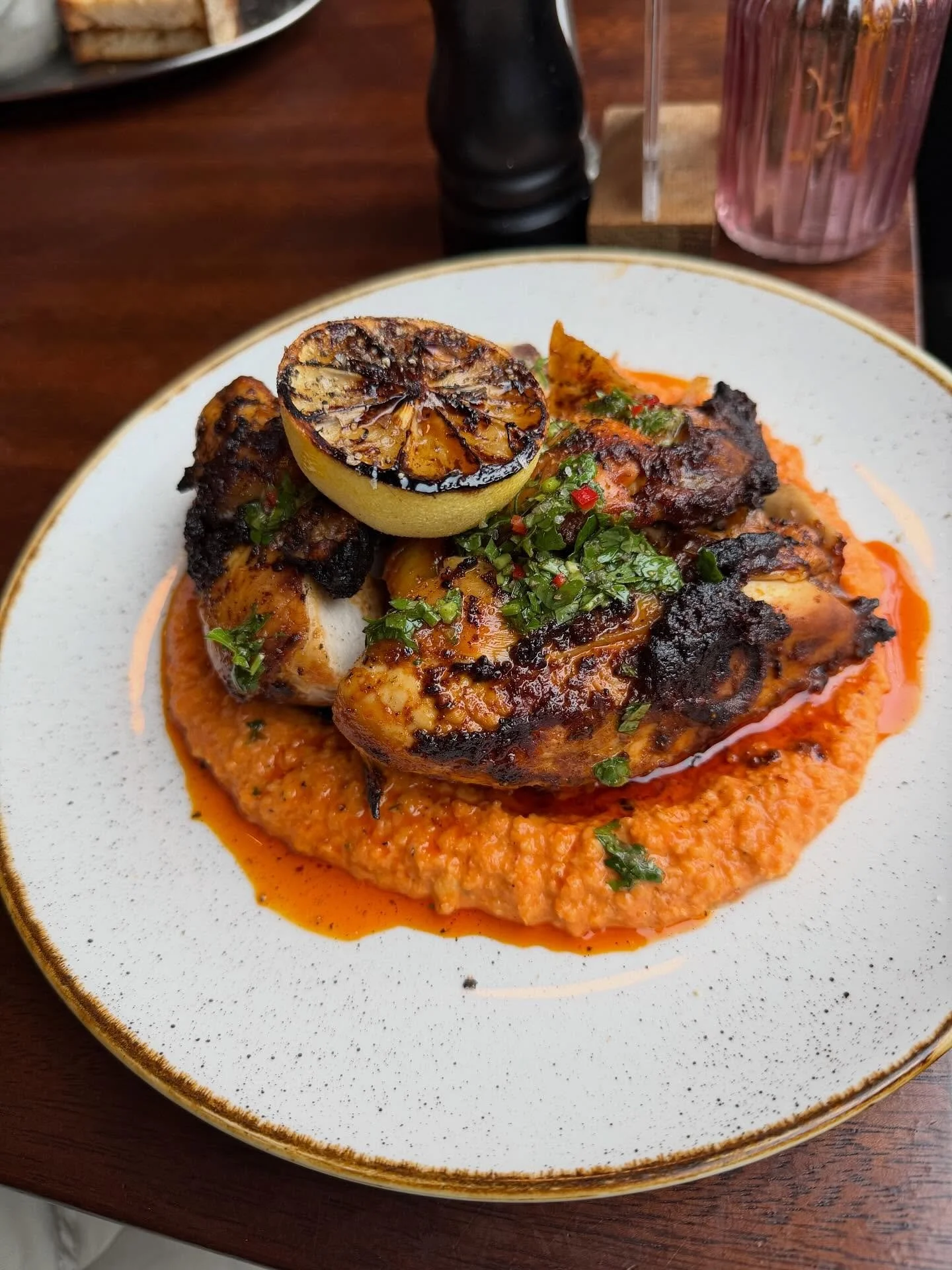 Half chicken on Romesco sauce with herby dressing. #sundaylunch