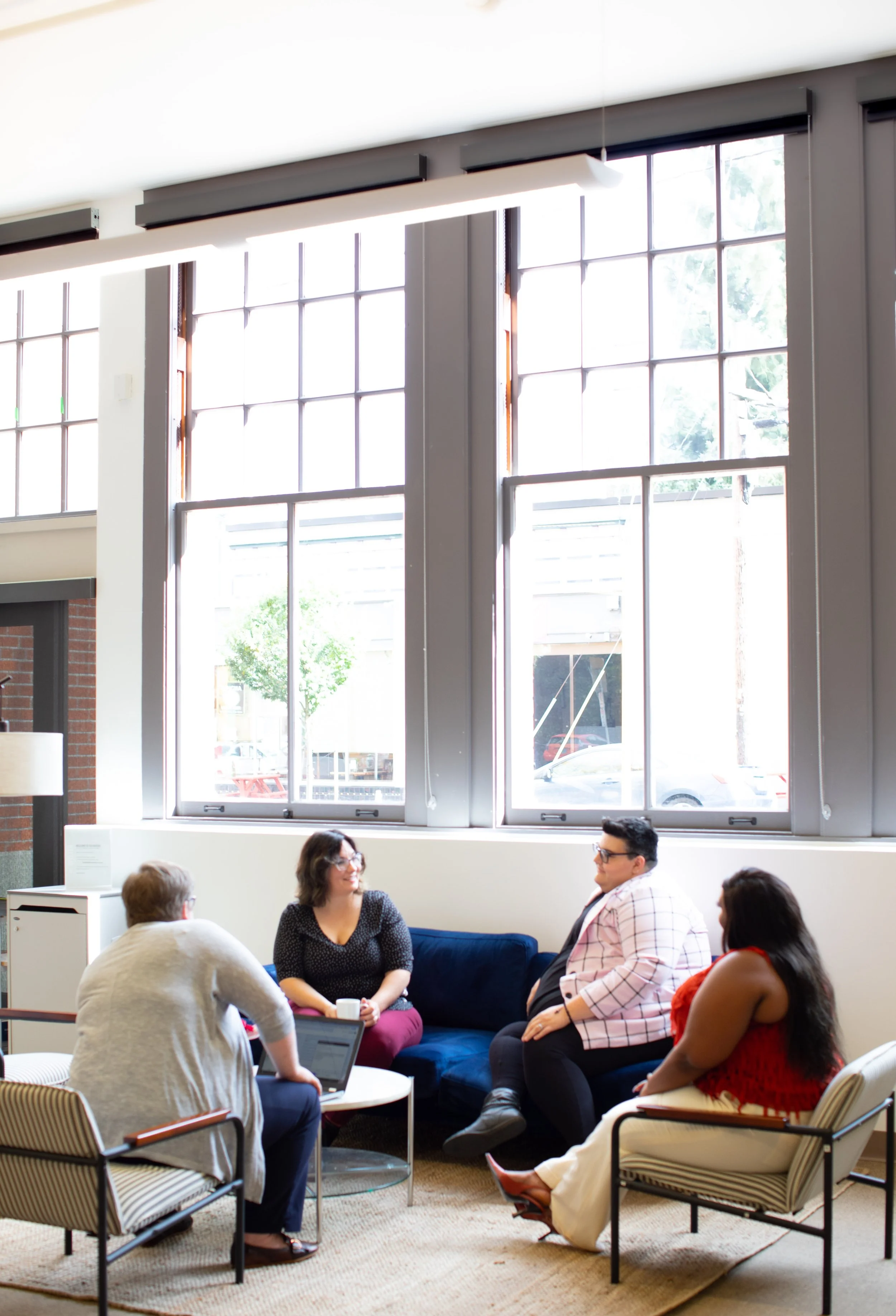 group of people sitting around talking