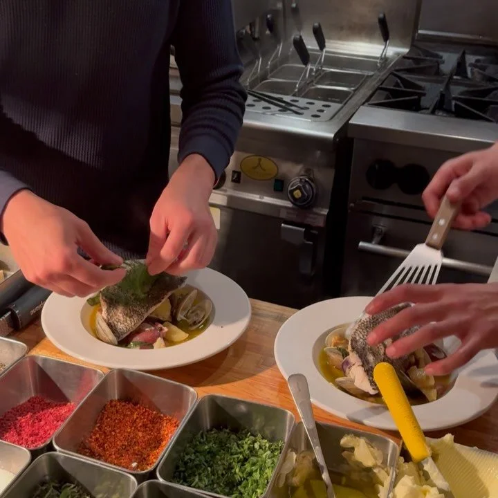 Steamed sea bass and little-neck clams in an aromatic white-wine broth, topped with a bright herb salad. Best with a side of bread for soaking up every last drop 🥖!!