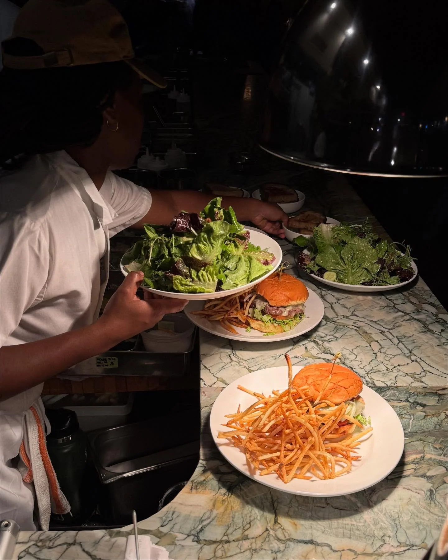 From 5-7 on weekdays, enjoy our Margot Burger and a martini for $25. 

The burger comes on a toasted brioche bun with Margot sauce, melted white cheddar, and the essentials (tomato, lettuce, onion, pickles) &mdash; served medium rare.