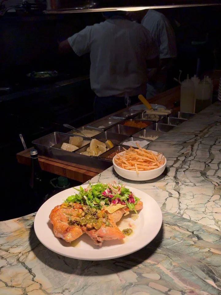 A much loved item on our menu right now &mdash; 

Our Zuni chicken is brined in koji, then stuffed with herbs and orange before roasting until the skin turns crisp. It&rsquo;s served with a panzanella of arugula and radicchio tossed in gremolata, Lau