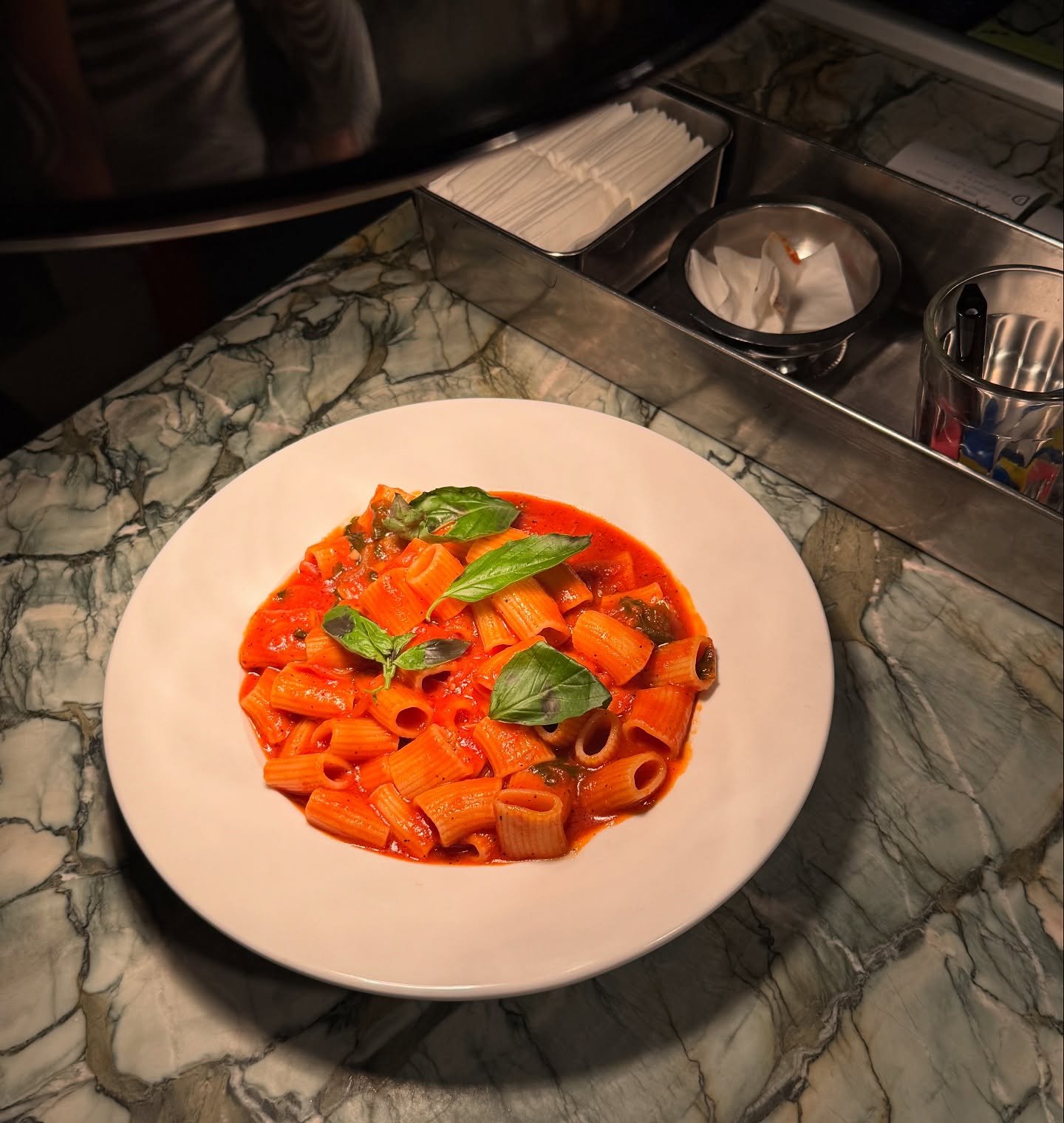 Rigatoni in a homemade heirloom tomato sauce, finished with fresh basil 🌿