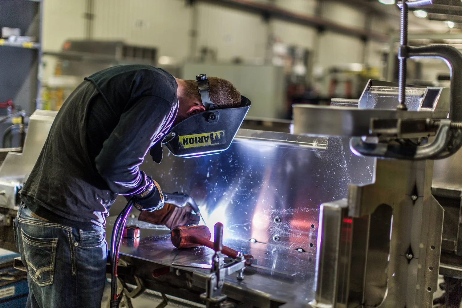 Welder at work in a manufacturing shop