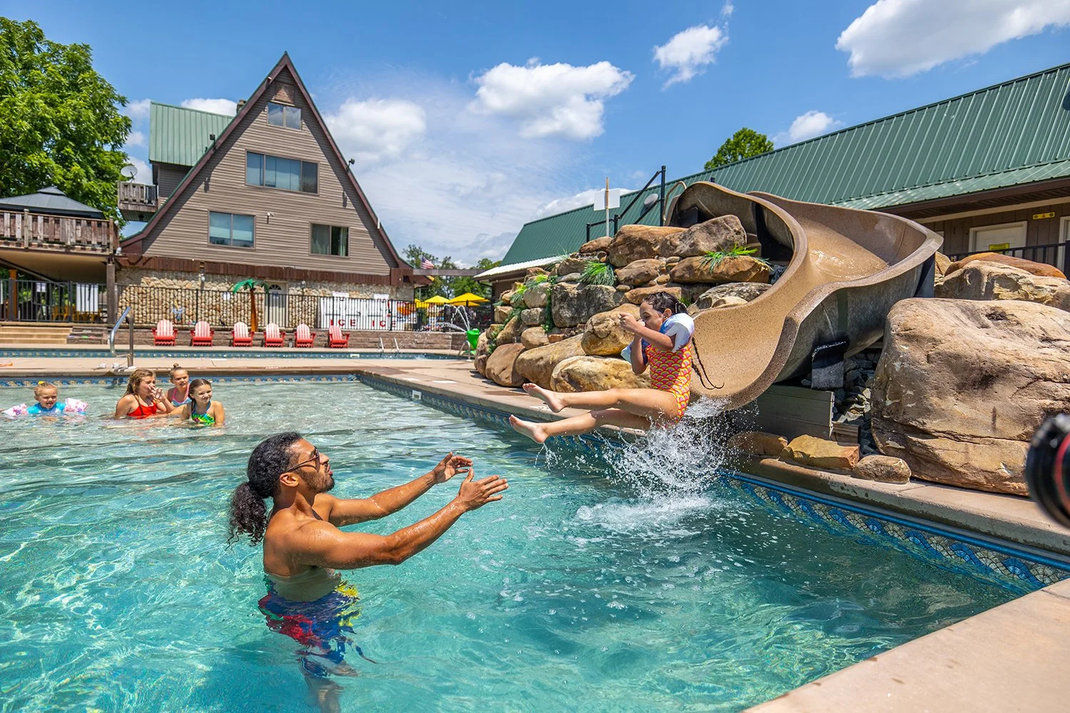 Woman relaxing in a resort pool on a summer trip