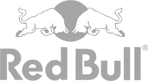 Red Bull logo featuring two charging bulls facing each other over a yellow circle with 'Red Bull' text underneath.
