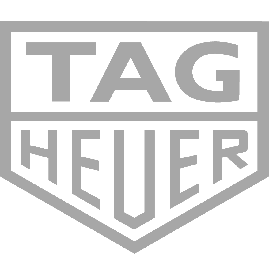 The TAG Heuer logo in black and gray with a shield shape design.
