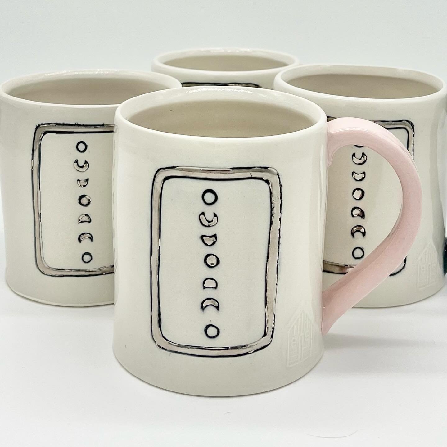 Moon mugs! 

There&rsquo;s a full moon tomorrow night (4/23) called the Pink Moon.  Cue up your Nick Drake, grab your incense and goddess energy, and make a toast to our very special satellite.

Porcelain with inlay and white gold. Handles colored wi