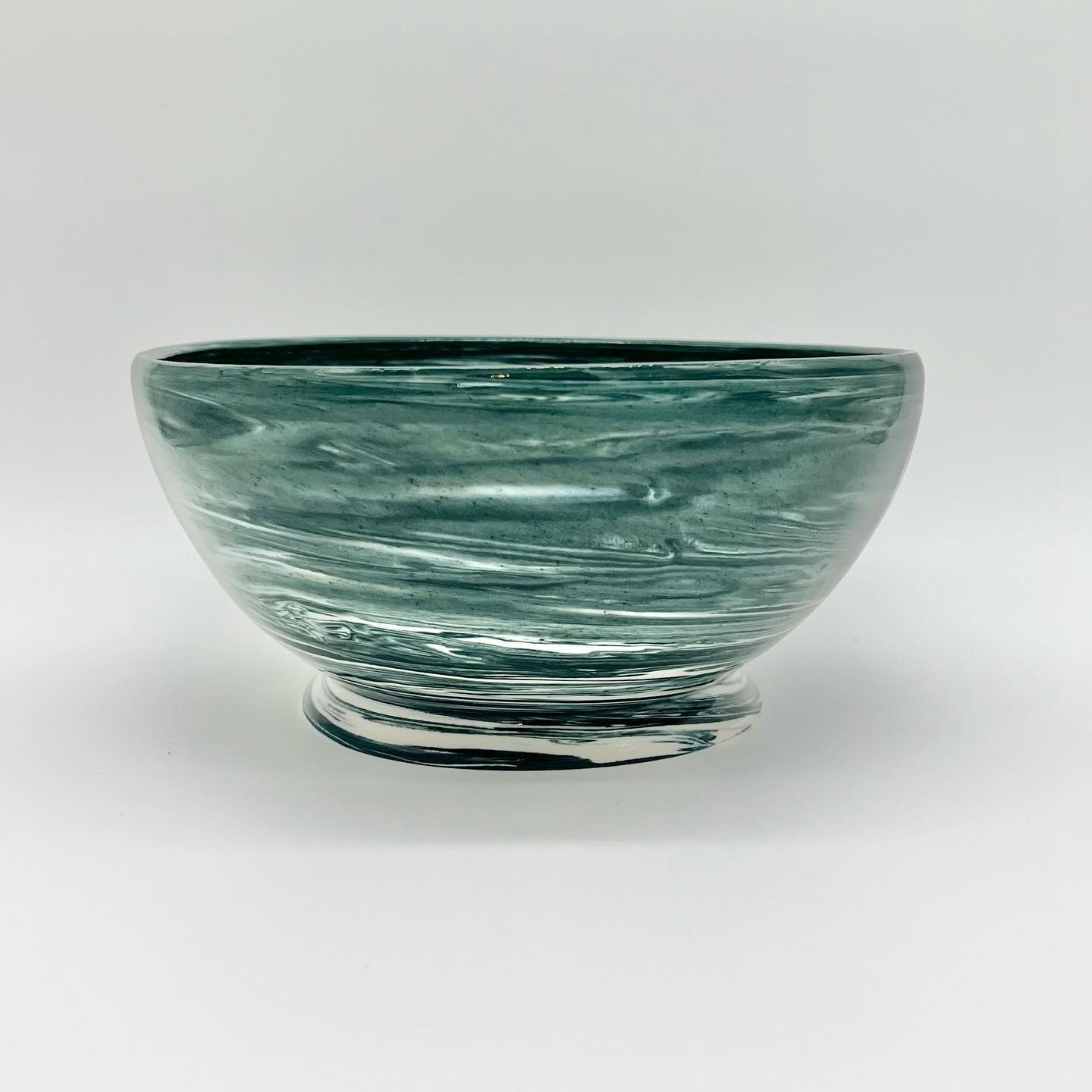Serving bowl, ready for a big steaming bowl of pasta with homemade marinara sauce. Maybe a jewel-colored fruit salad studded with pomegranate seeds.  Or a mountain of sourdough bread slices, crusty on the edges and chewy in the center, next to a plat