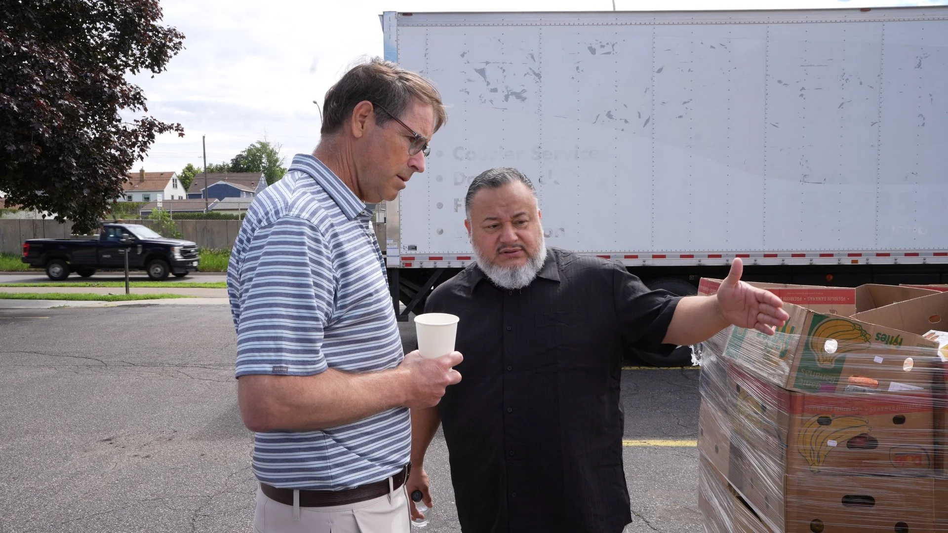 Two men talking about their plan for food insecurity