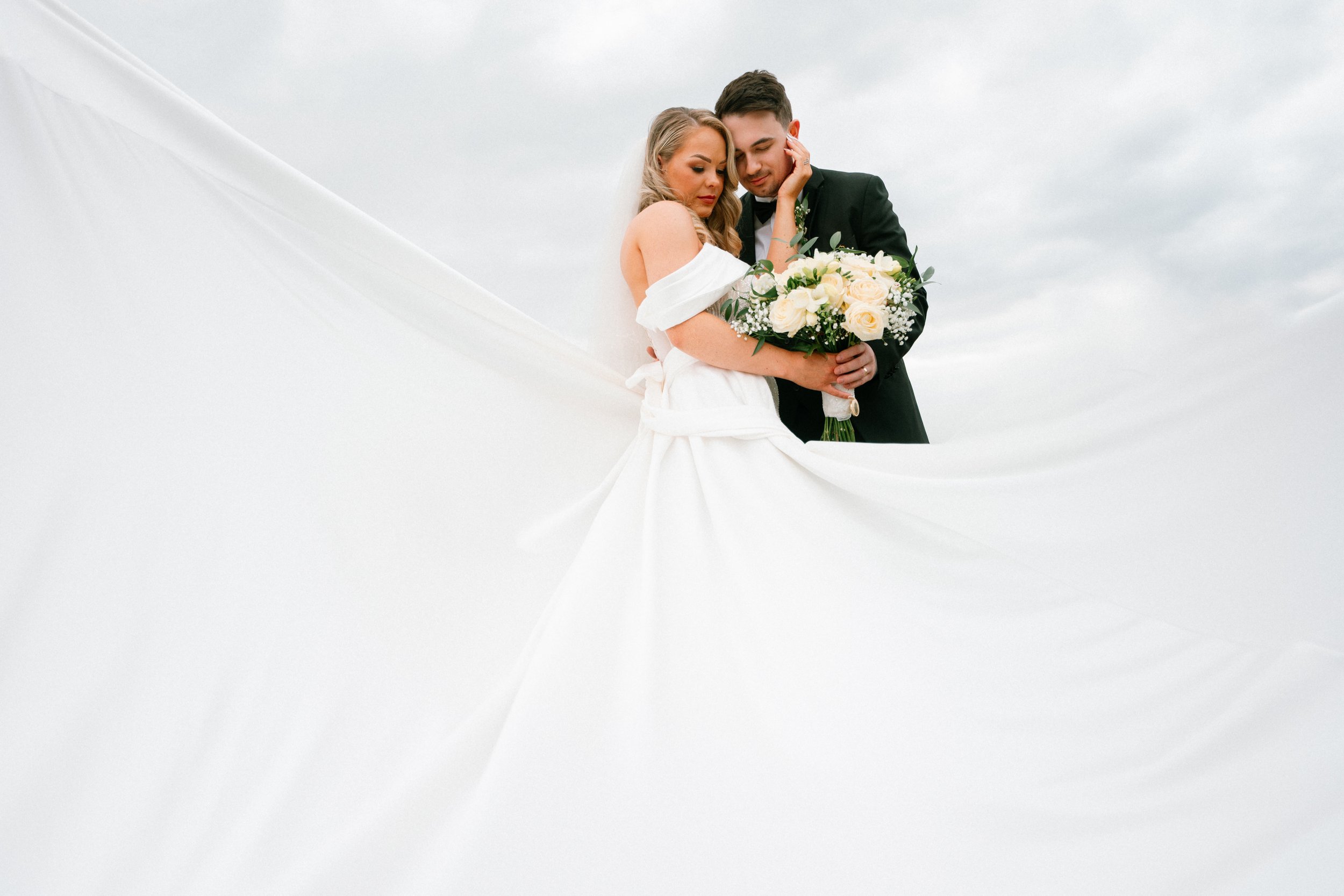Bride and groom model posing during a styled wedding photoshoot
