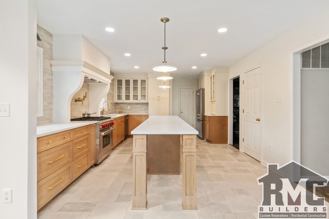 Transforming spaces with timeless elegance ➡️ Our latest kitchen renovation blends classic design with modern touches. From warm wood cabinetry and sleek countertops to custom details like the columned island and brass fixtures, this kitchen is the p