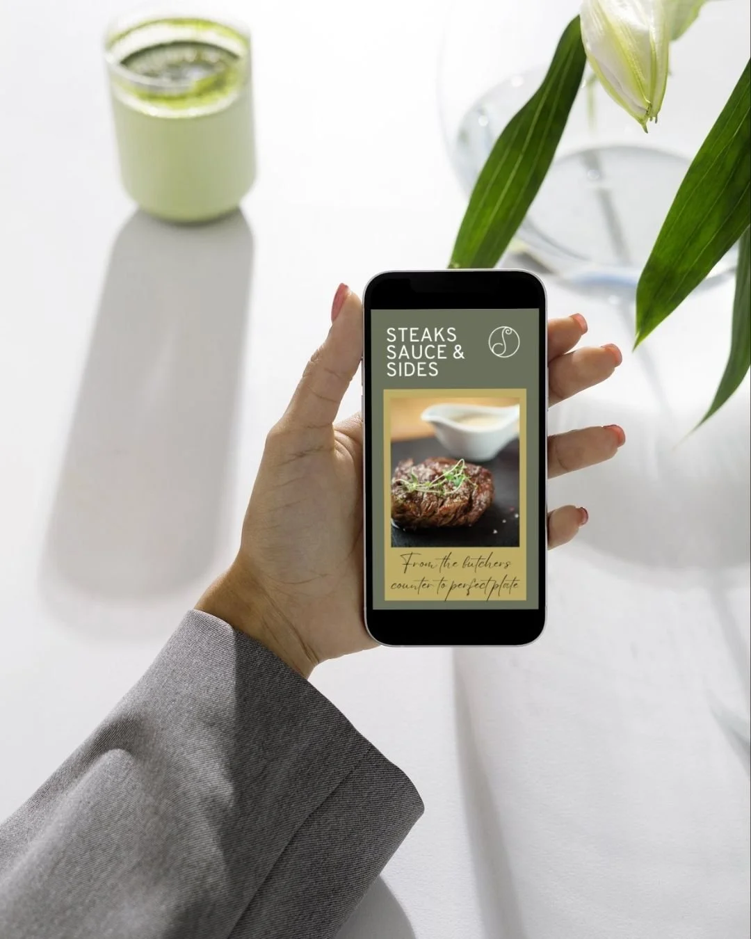 A smartphone showing the screen while a DCS Reel plays showcasing Steaks Sauces and Sides Class